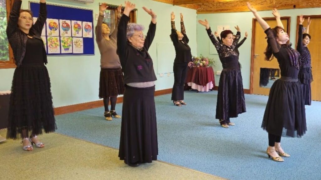 Members of a Korean seniors group practise yoga at a Winter Engagement Fund event