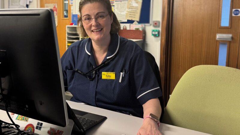 urgent community response nurse Kyley Parfitt sits at her computer