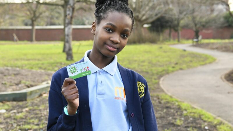 Merton abbey primary pupil holds beat the street game card